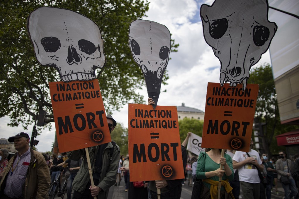 Protesters take part in a demonstration against global warming in Paris, France on Sunday, with placards reading ‘Climate inaction = death’. Photo: EPA-EFE