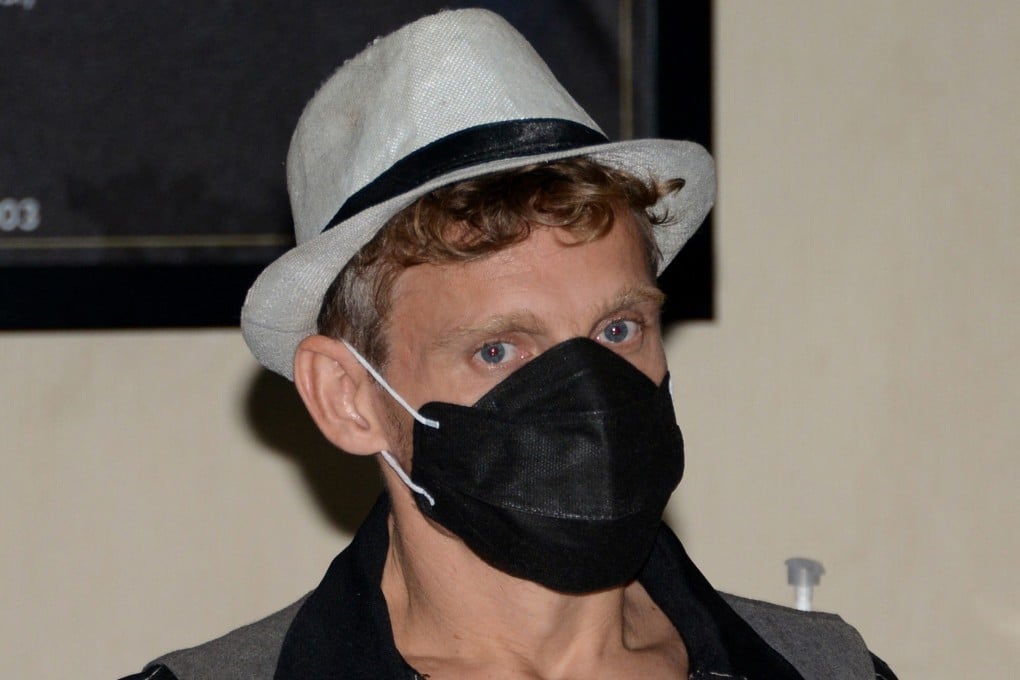 Canadian Christopher Kyle Martin before his flight out of Indonesia's resort island of Bali, after he was expelled for offering an orgasmic yoga class. Photo: AFP