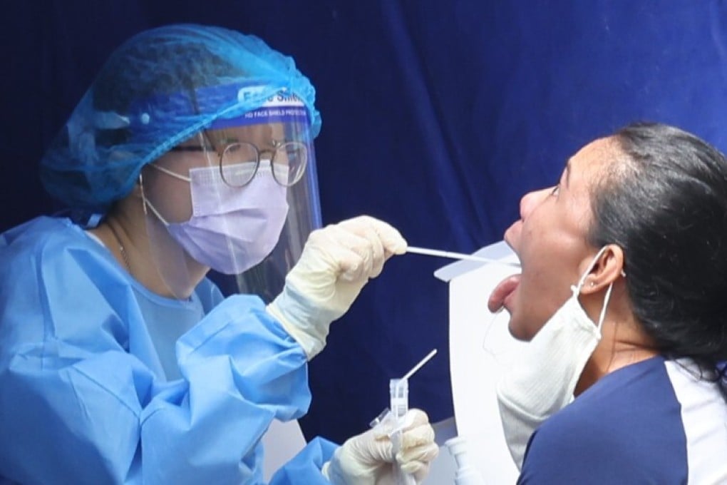 Carrie Lam has withdrawn a controversial plan to require vaccinations of Hong Kong’s nearly 400,000 domestic helpers, though more mandatory testing is in the offing. Photo: Nora Tam