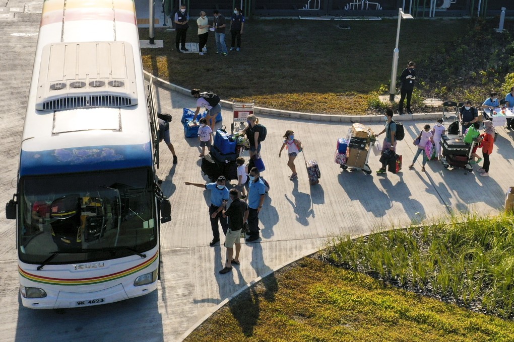 People leave the quarantine centre at Penny’s Bay on Lantau Island on Saturday. Photo: Nora Tam