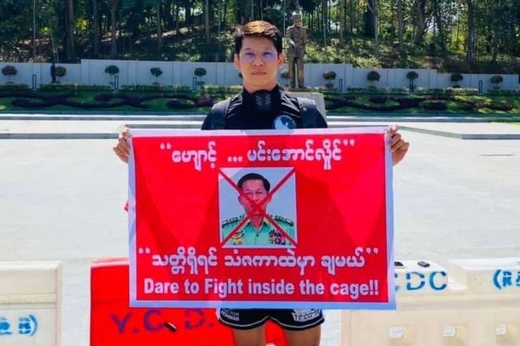 Phoe Thaw holds up a sign challenging Myanmar army general Min Aung Hlaing to a fight. Photo: Twitter