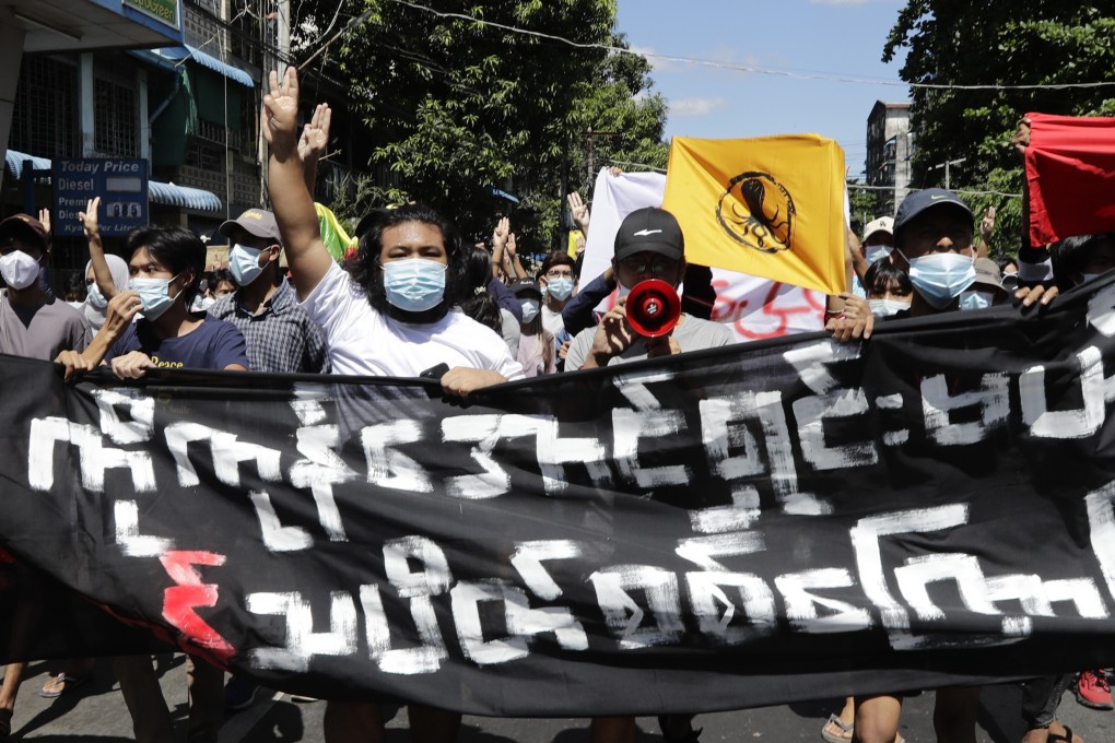 Protesters hold up the three-finger salute during a demonstration against Myanmar’s military coup in Yangon on Tuesday. Photo: EPA