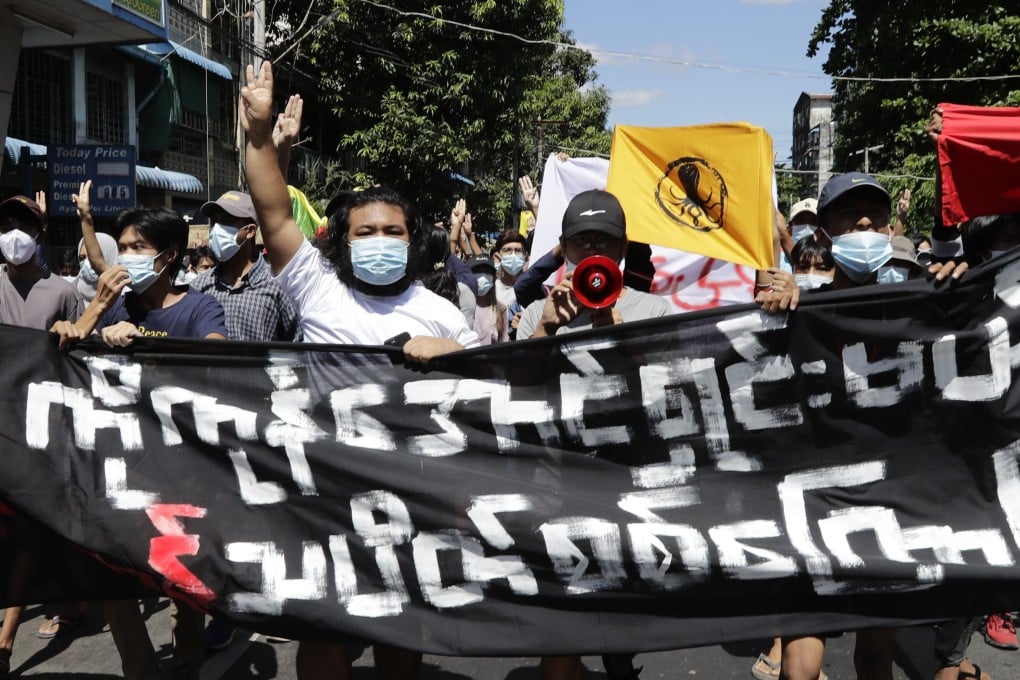 Protesters hold up the three-finger salute during a demonstration against Myanmar’s military coup in Yangon on Tuesday. Photo: EPA