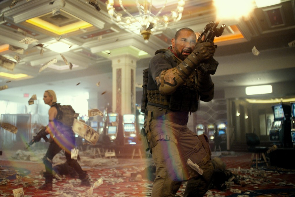 Dave Bautista (front) and Nora Arnezeder in a still from Army of the Dead. Photo: Netflix