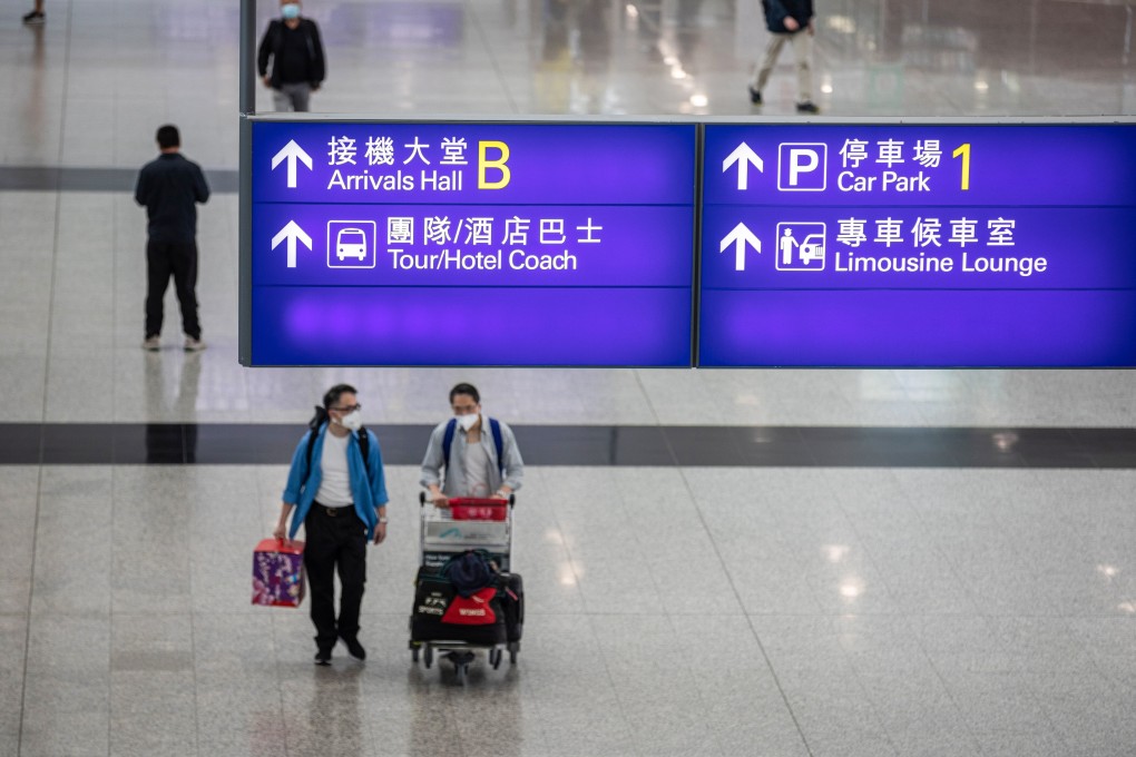 Passengers walk through the arrival hall at Hong Kong International Airport in April. Photo: EPA-EFE