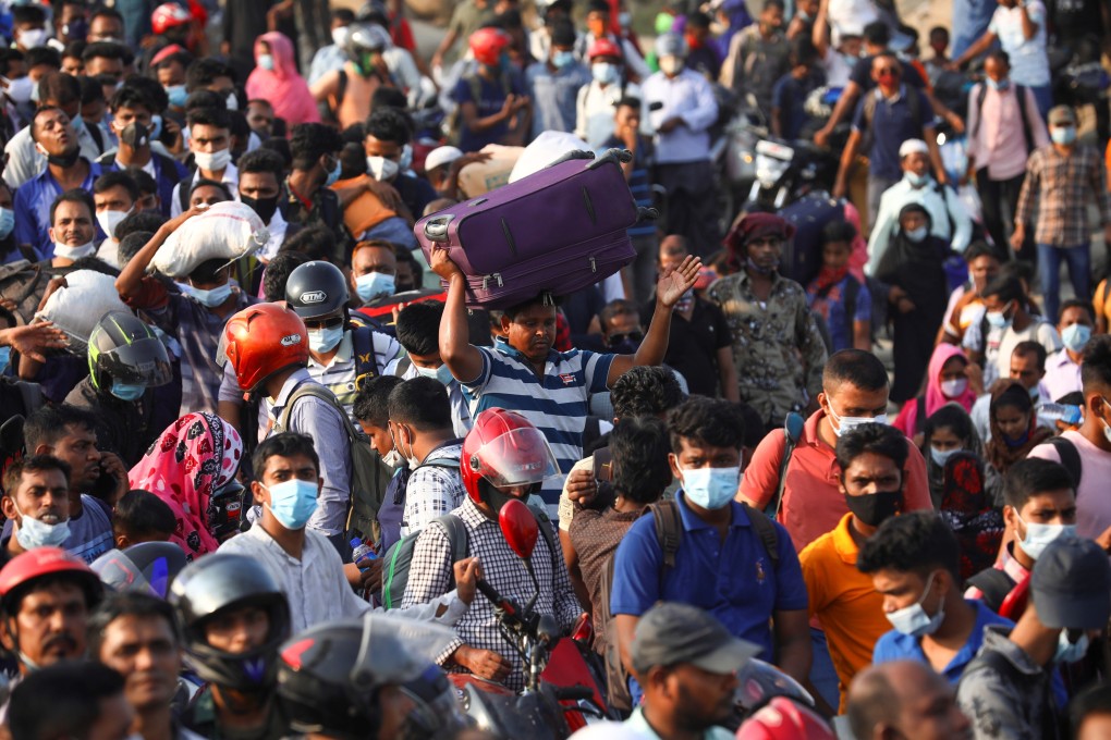 People rush to board a ferry with their belongings at Mawa Ferry Terminal to get home to celebrate Eid al-Fitr in Munshiganj, Bangladesh on Wednesday. Photo: Reuters