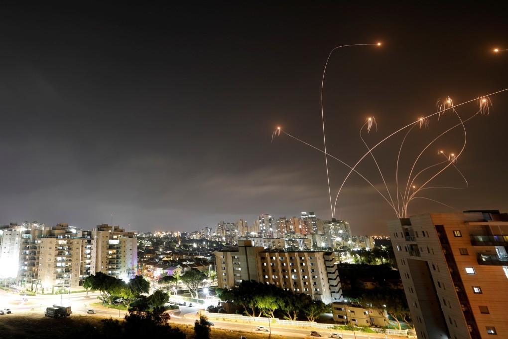 Streaks of light are seen as Israel's Iron Dome anti-missile system intercepts rockets launched from the Gaza Strip towards Israel on Monday. Photo: Reuters