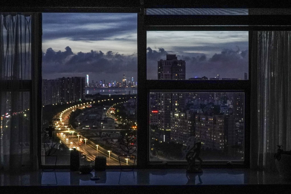 The Beijing-Hong Kong-Macau expressway is lit up with Shenzhen’s Nanshan district in the background. Photo: Roy Issa
