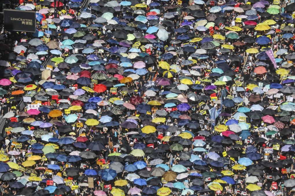 Protesters march from Victoria Park in Causeway Bay on the 22nd anniversary of Hong Kong's handover from Britain to China. Photo: Dickson Lee