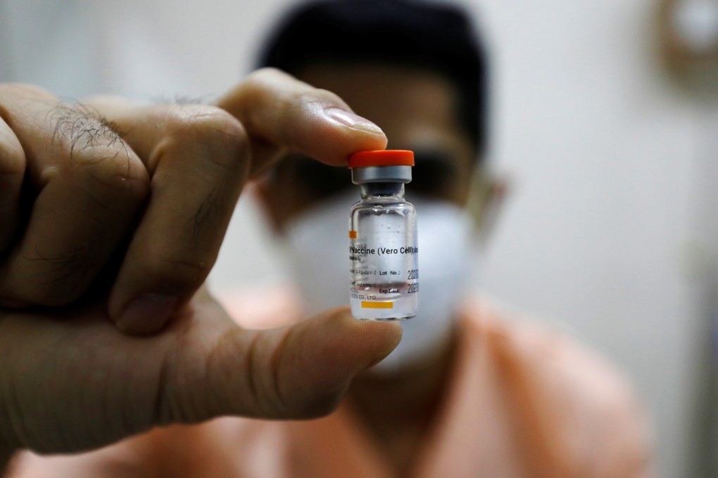 A doctor shows a bottle of the Sinovac vaccine in Jakarta before receiving a dose of it, as Indonesia began its mass vaccination drive for Covid-19 in January. Photo: Reuters