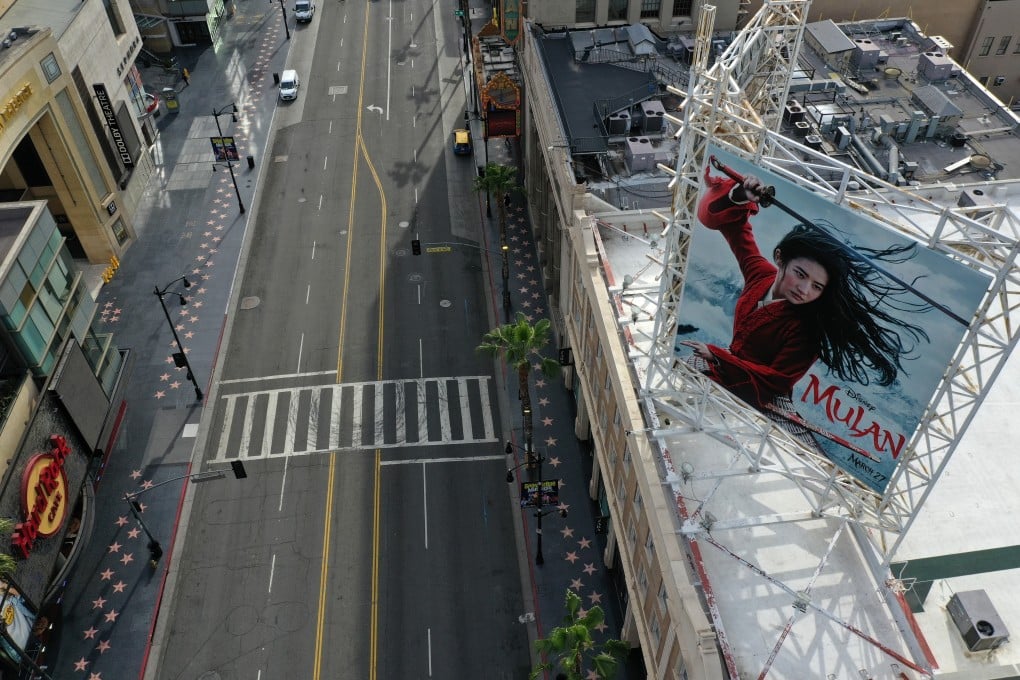 A poster for the Disney movie “Mulan” towers over an empty Hollywood Boulevard in Los Angeles during the coronavirus pandemic in March 2020. Photo: Reuters