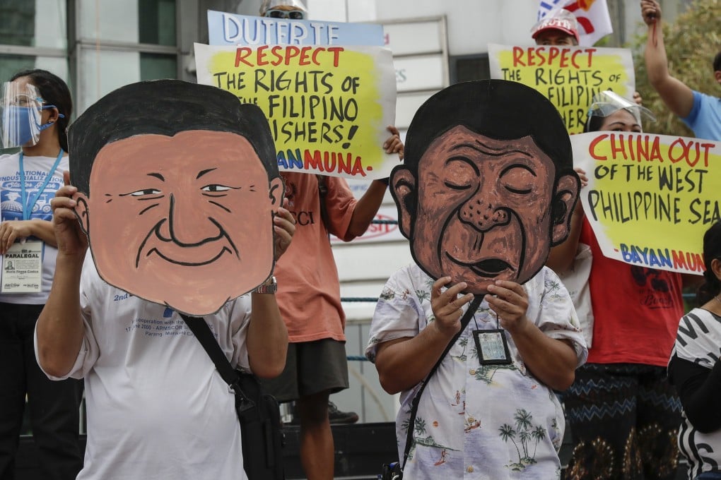 Protesters wear a mask of Philippine President Rodrigo Duterte and Chinese President Xi Jinping during a rally on May 7, 2021. Photo: AP