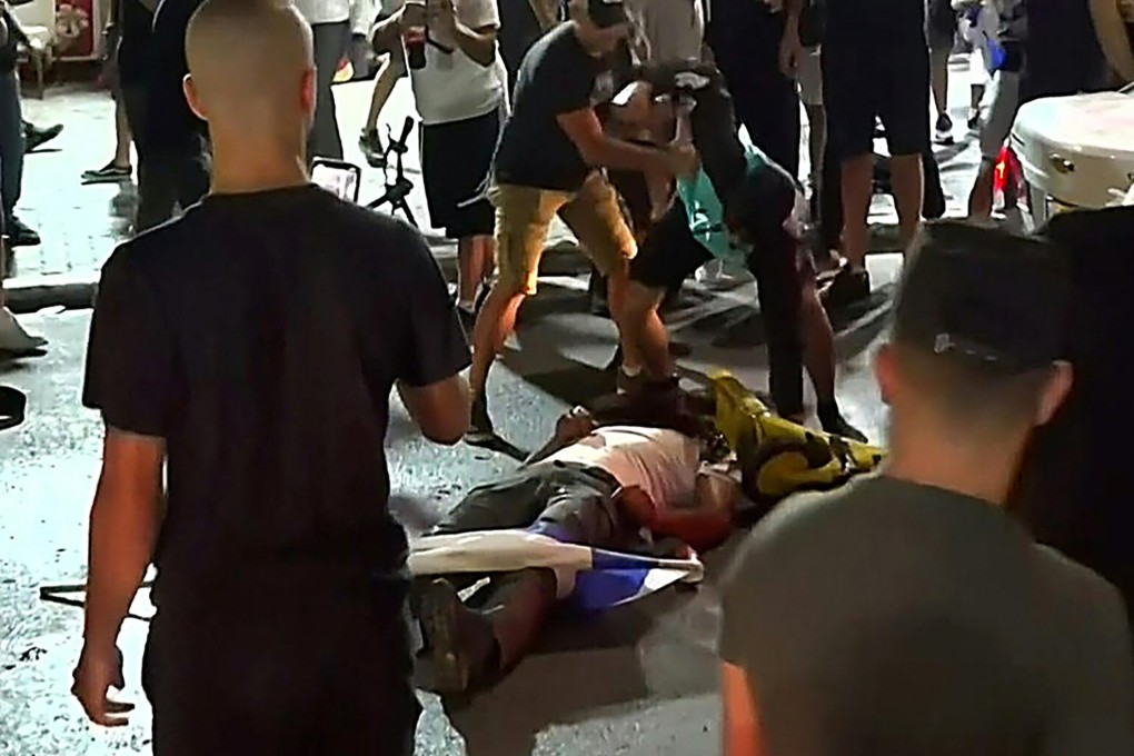 Television footage shows an Israeli mob attacking a person they considered an Arab man on the seafront promenade of Bat Yam, a town south of Israel's commercial capital Tel Aviv. Photo: Kan 11 public broadcaster via AFP