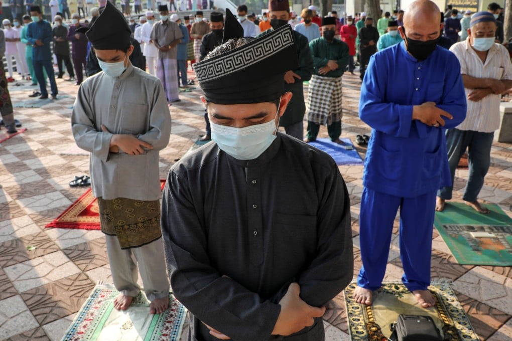 Muslims pray outside Malaysia’s National Mosque while marking Eid ul-Fitr in Kuala Lumpur on Thursday. Photo: Reuters