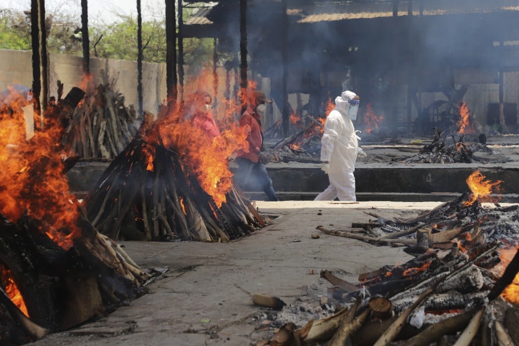 Multiple funeral pyres of people who died of Covid-19 burn at the Ghazipur crematorium in New Delhi. Photo: AP