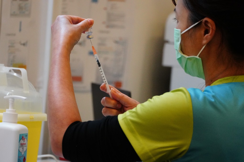 A Covid-19 vaccination programme for government officers under way at the Central Library in Causeway Bay. Photo: Sam Tsang