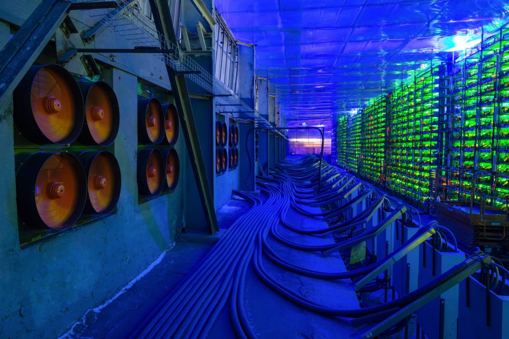 Industrial fans operate to cool mining rigs at the CryptoUniverse cryptocurrency mining farm in Nadvoitsy, Russia. Some people see mining virtual currencies as just another way to increase passive income but they may end up investing too much, including in mining equipment. Photo: Bloomberg