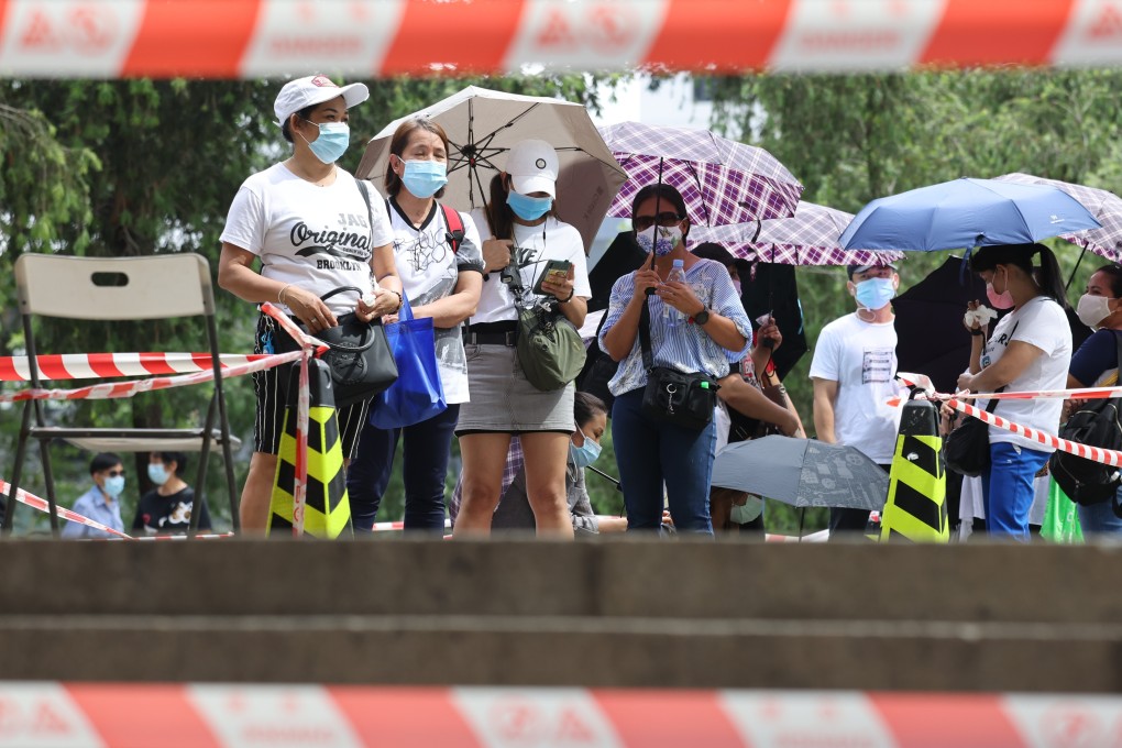 Domestic helpers queue for Covid-19 testing at Chater Garden in Central on May 9. Photo: Nora Tam