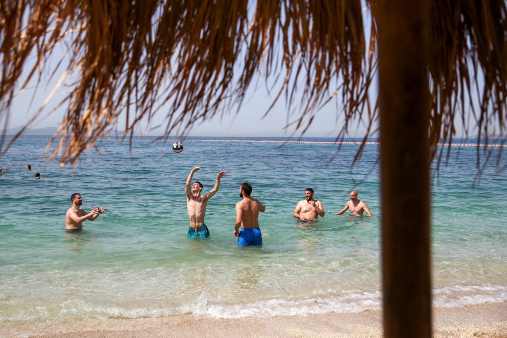 Holidaymakers on a beach in Athens, Greece. Europe’s top tourist destinations are gearing up to welcome visitors back over the summer. Photo: Reuters