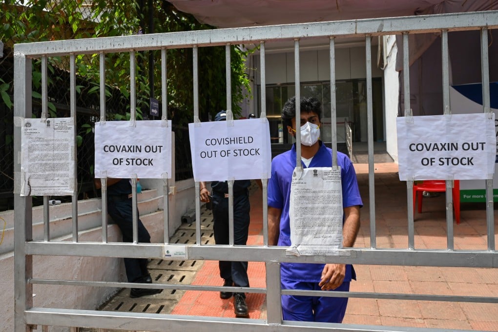 Signs announcing that vaccines are out of stock are seen at the entrance to a vaccination centre amid a shortage of vaccine supplies in Mumbai on April 30. Photo: AFP