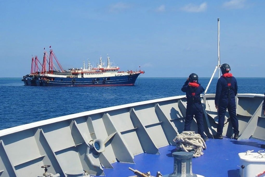 Philippine coastguard personnel monitor Chinese vessels anchored at Sabina Shoal, a South China Sea outcrop claimed by Manila. Photo: Philippine coastguard via AFP