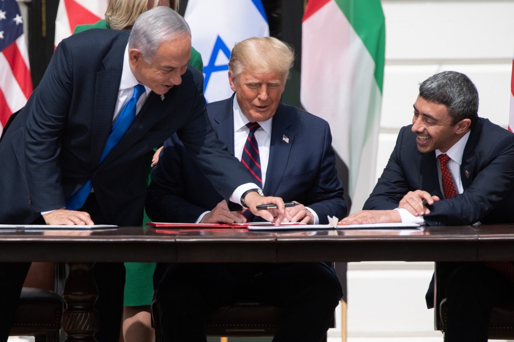 Israeli Prime Minister Benjamin Netanyahu, former US president Donald Trump and UAE Foreign Minister Abdullah bin Zayed Al-Nahyan signing the Abraham Accords in September 2020. Photo: AFP