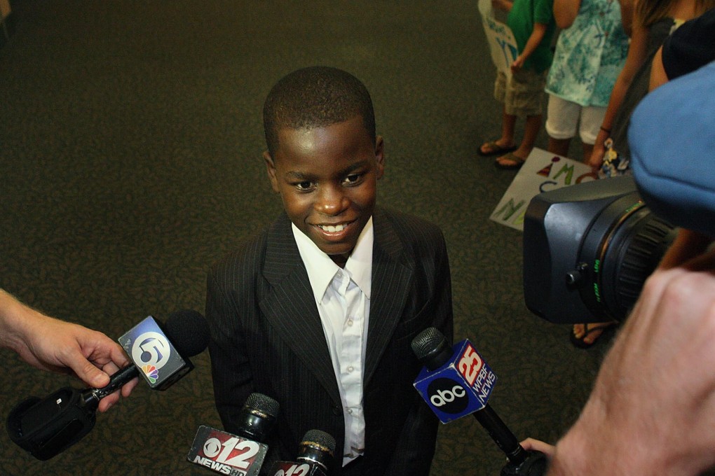 Damon Weaver is greeted by the media in August 2009 at the Palm Beach International Airport. Photo: Palm Beach Post/TNS