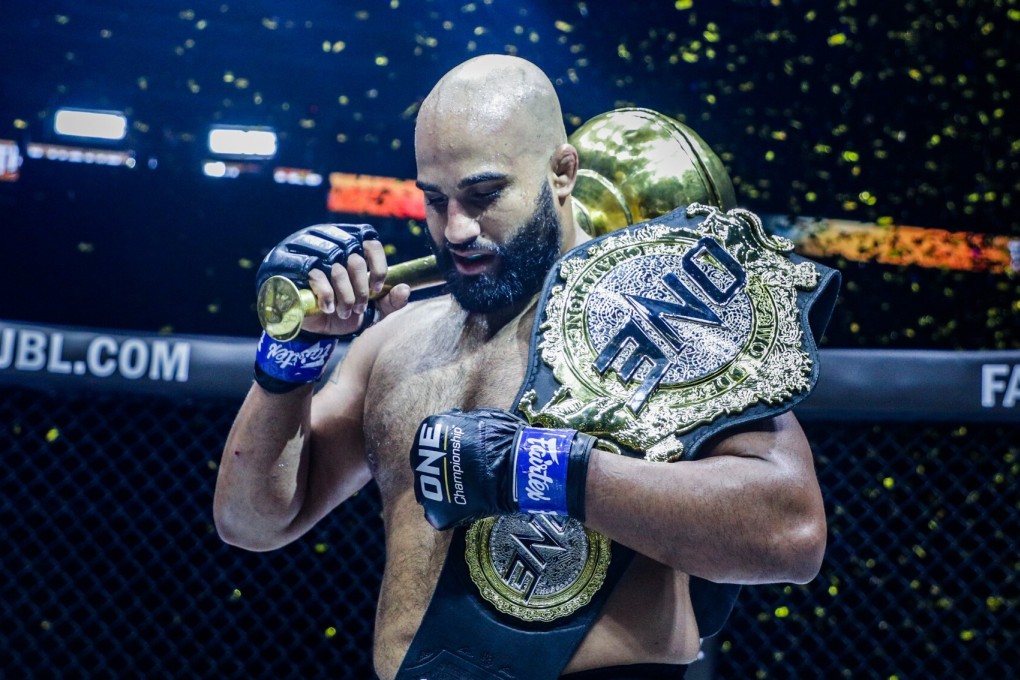 Arjan Bhullar celebrates with the ONE heavyweight world title. Photos: Dux Carvajal/ONE Championship