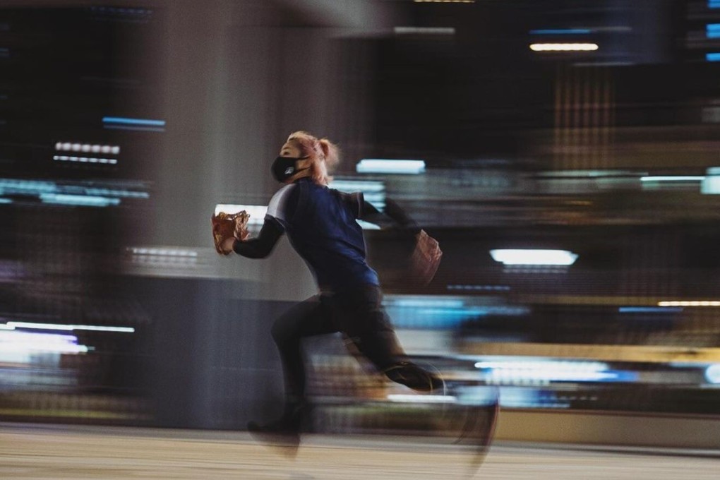 Hong Kong softball player Yaffa Lam runs after a high ball during practice. Photos Handout
