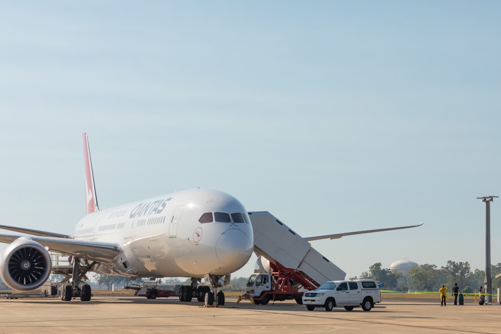 Passengers disembark from a Qantas repatriation flight from India in Darwin, Australia. Photo: EPA-EFE