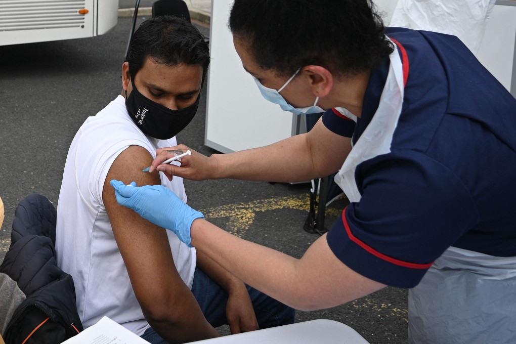 A member of the public receives a Covid-19 vaccine on Friday at a temporary vaccination centre in Bolton, northwest England, which with Blackburn has been at the centre of Britain’s rising B1.617.2 variant cases. Photo: AFP