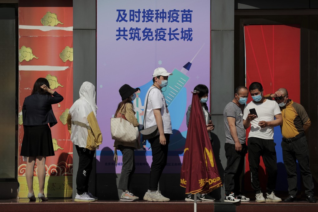 Residents line up for the Sinopharm Covid-19 vaccine in Beijing on Monday. Photo: AP