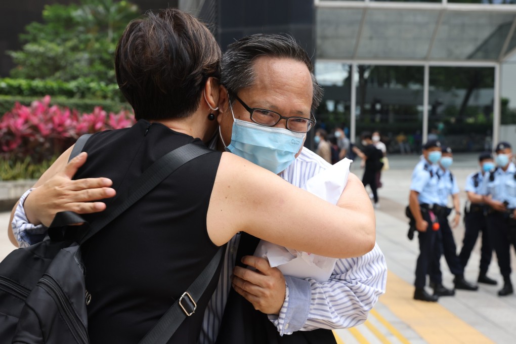 Democrat Albert Ho and former party lawmaker Emily Lau Wai-hing hug outside the District Court in Wan Chai on Monday. Photo: Nora Tam