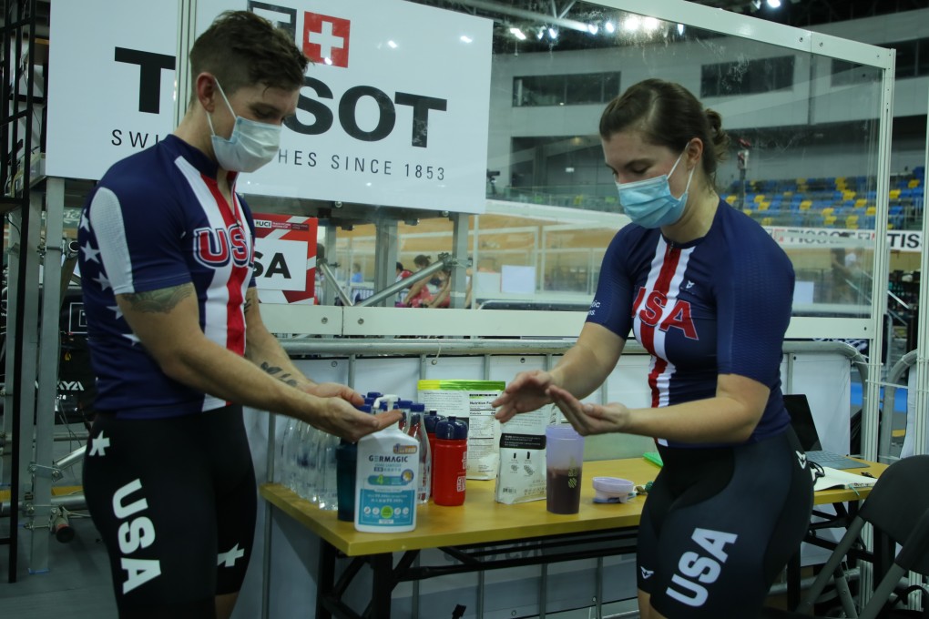 Two cyclists from Team USA sanitising their hands after a training session ahead of their UCI Track Cycling Nations Cup men's and women's races at the Hong Kong Velodrome in Tseung Kwan O. Photo: Cycling Association of Hong Kong