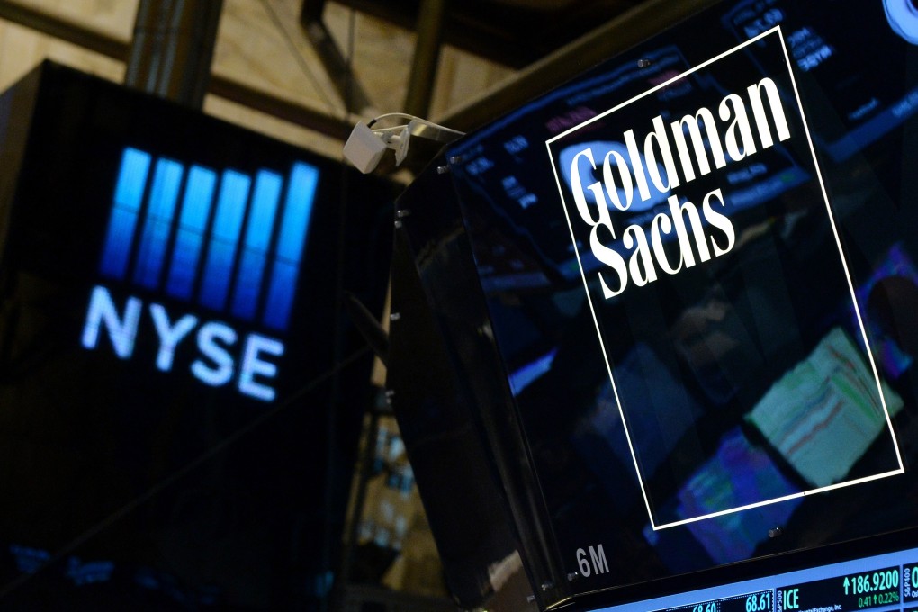A Goldman Sachs sign on the floor of the New York Stock Exchange. Goldman plans to add more than 400 staff in mainland China and Hong Kong this year. Photo: EPA-EFE