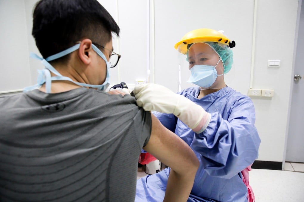 A nurse wearing personal protective equipment administers AstraZeneca Covid-19 vaccine at Chang Gung Memorial Hospital in Taipei, Taiwan, on Thursday, May 13, 2021. A rising number of Covid-19 infections is prompting thousands of members of the hesitant Taiwanese public to get vaccinated. Photo: Bloomberg