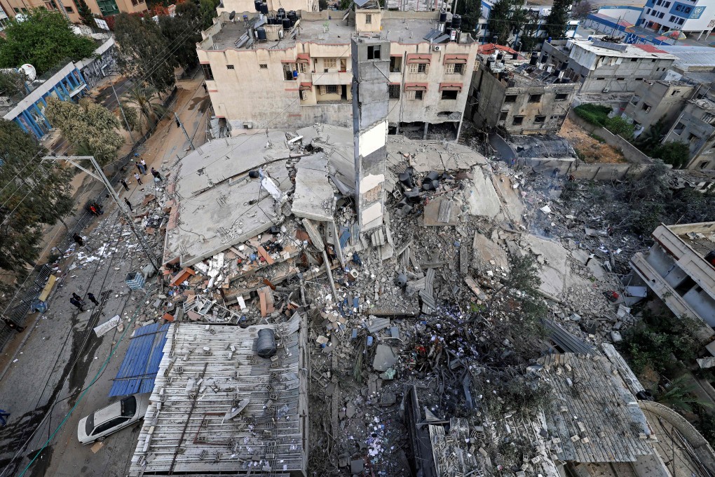 The remains of a destroyed residential building which was hit by Israeli air strikes in Gaza City on Tuesday. Photo: AFP
