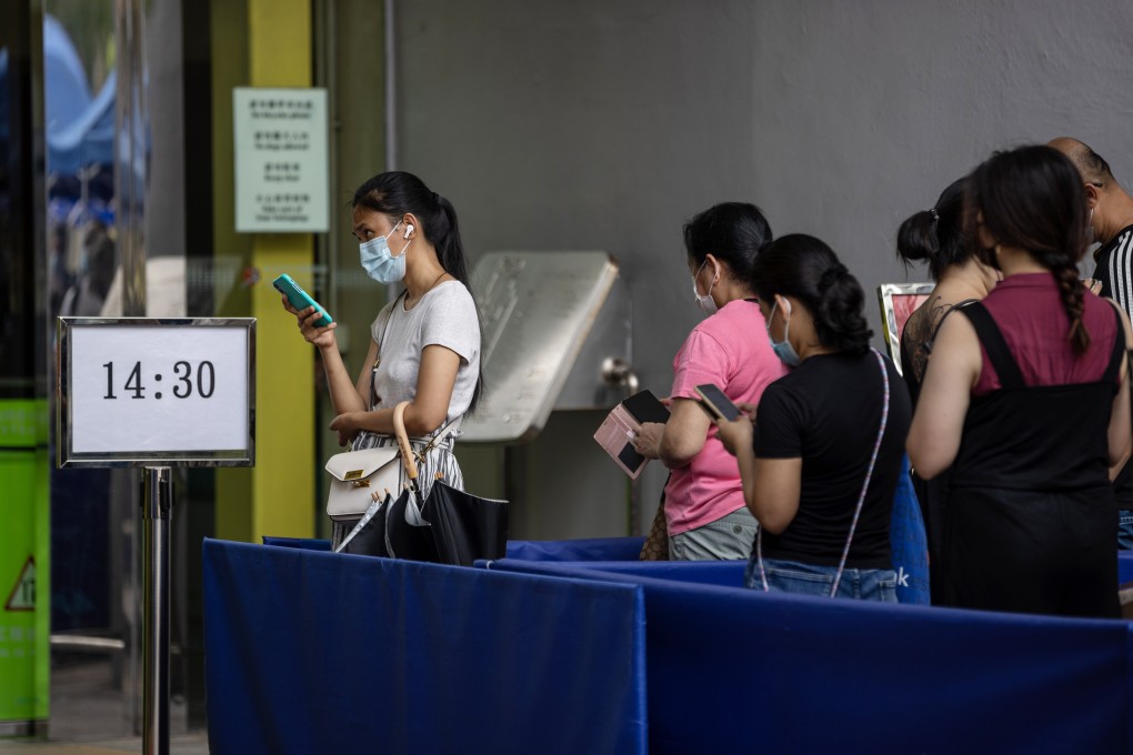 People line up outside a community vaccination centre to receive the Covid-19 vaccine in Hong Kong on May 12. Only about 10 per cent of the Hong Kong population have been fully vaccinated. Photo: EPA-EFE