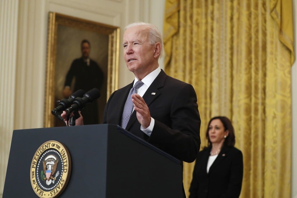 US President Joe Biden, with Vice-President Kamala Harris in the background, announces the US will donate 80 million vaccine doses to the rest of the world. Photo: TNS