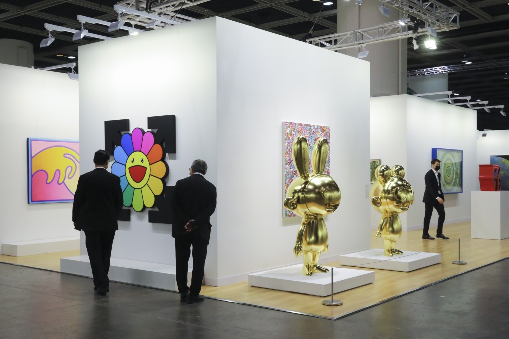 Attendees look at art on display at a mini Art Basel Hong Kong held in November 2020 at the Hong Kong Convention and Exhibition Centre. The fair is back at the venue this week, with about half the usual number of galleries exhibiting art for sale. Photo: Dickson Lee