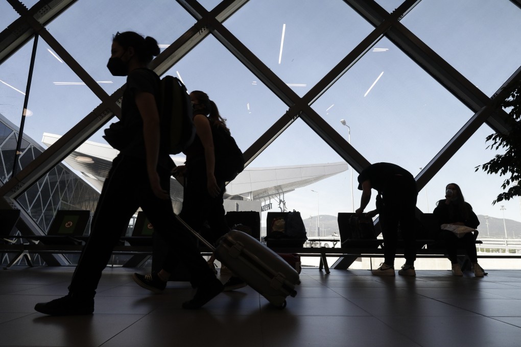 Passengers walk through a terminal at Thessaloniki Makedonia Airport in Greece. Photo: Bloomberg