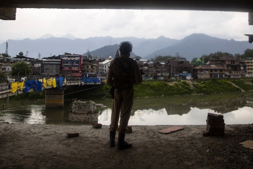 A paramilitary soldier keeps a vigil from inside a building under construction in Srinagar, Indian-administered Kashmir, in April. Photo: AP