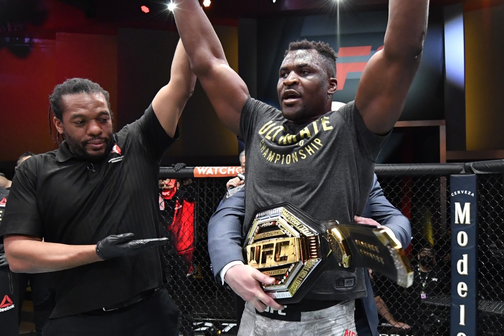 Francis Ngannou celebrates with the heavyweight title after beating Stipe Miocic at UFC 260. Photos: USA Today Sports