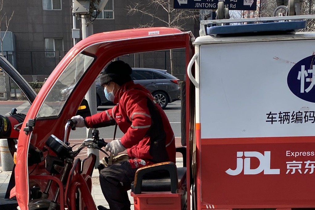 A JD Logistics delivery driver on the streets of Beijing in February. The company is set to raise US$3.2 billion in its Hong Kong IPO. Photo: Minghe Hu