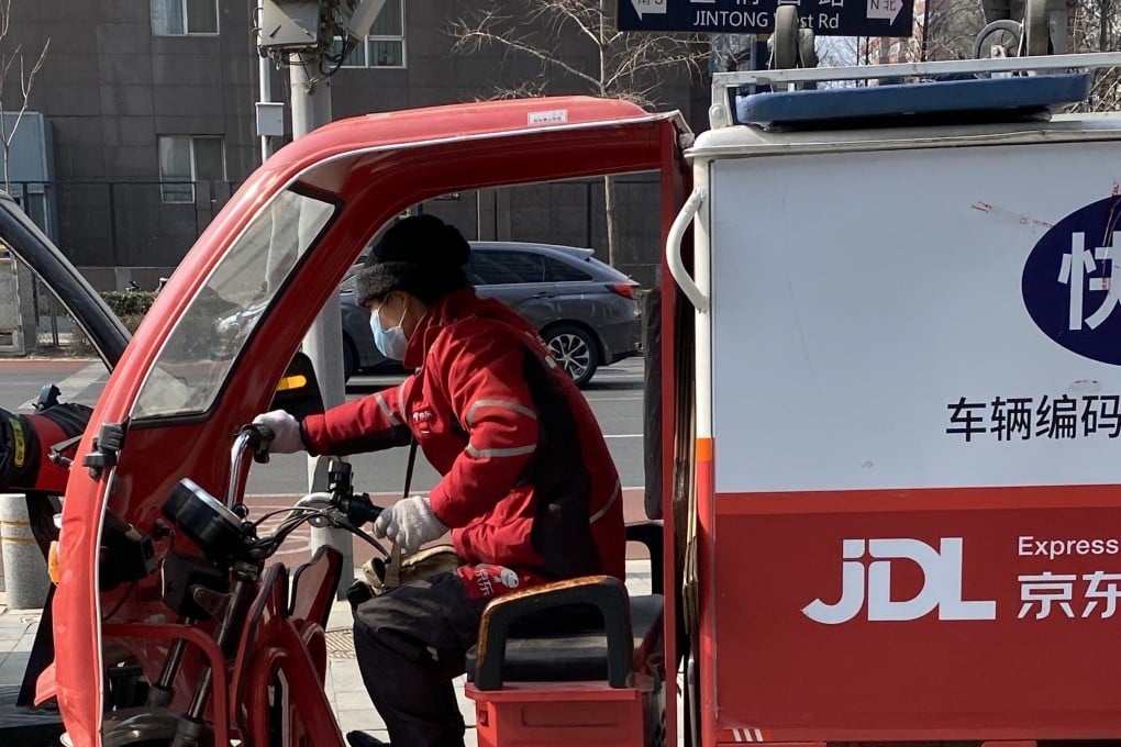 A JD Logistics delivery driver on the streets of Beijing in February. The company is set to raise US$3.2 billion in its Hong Kong IPO. Photo: Minghe Hu