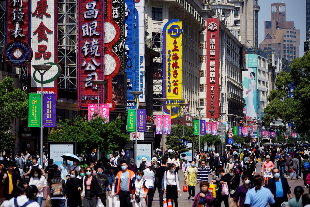 People walk along Nanjing Pedestrian Road, a main shopping area in Shanghai, on May 5. China’s core consumer price index, which excludes food and energy, grew just 0.7 per cent year on year in April. Photo: Reuters
