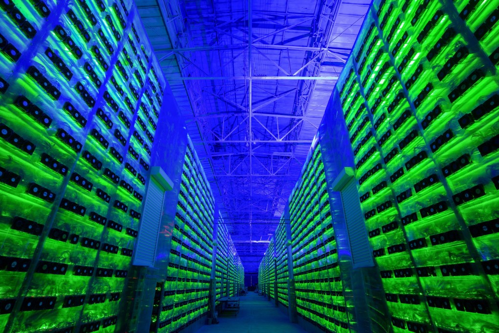 Illuminated mining rigs operate inside racks at the CryptoUniverse cryptocurrency mining farm in Nadvoitsy, Russia, on March 18. Photo: Bloomberg