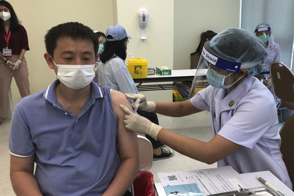 A health worker administers a dose of the Sinovac Covid-19 vaccine to Chinese national Zhang Xiaohong at Bangrak Vaccination and Health Centre in Bangkok, Thailand, on Thursday. Photo: AP