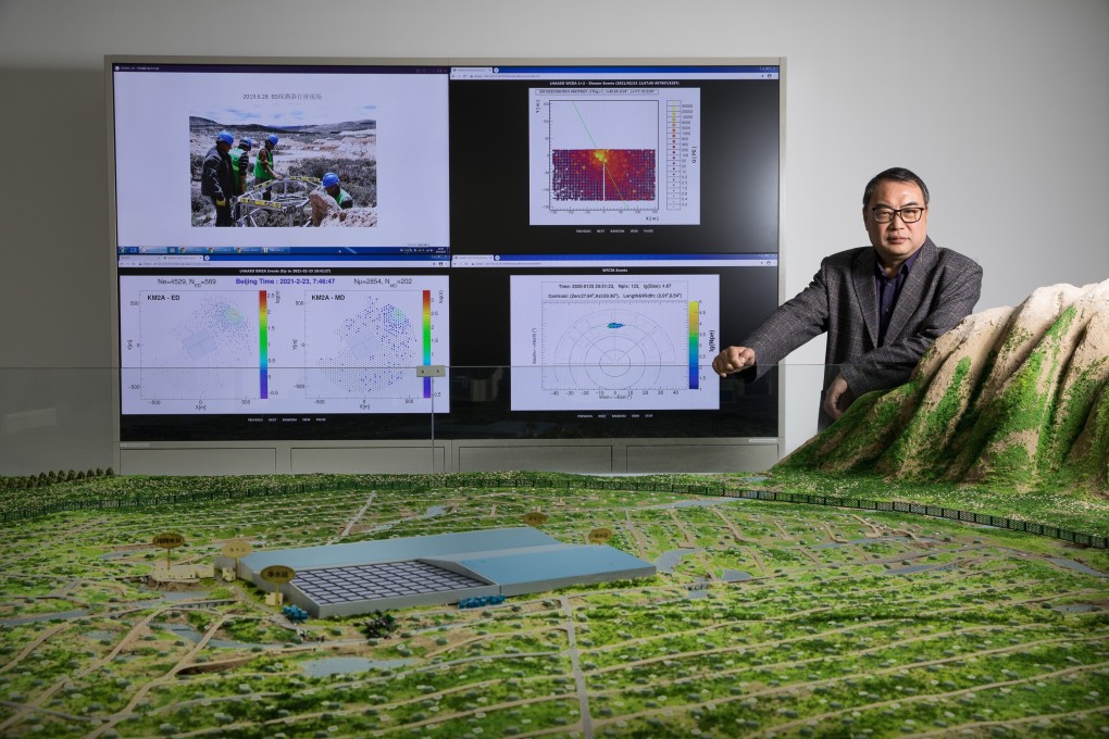 Cao Zhen, a researcher at the Institute of High Energy Physics (IHEP) is pictured with a model of China's Large High Altitude Air Shower Observatory (Lhaaso). Photo: Xinhua