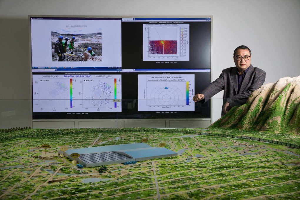 Cao Zhen, a researcher at the Institute of High Energy Physics (IHEP) is pictured with a model of China's Large High Altitude Air Shower Observatory (Lhaaso). Photo: Xinhua